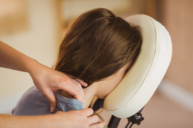 woman getting a chair massage